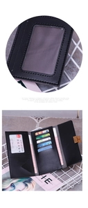 Detail of slim black trifold wallet featuring multiple card slots and metal buckle