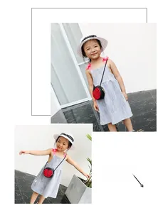 Detail view of child wearing a red ladybug crossbody bag with black polka dots