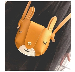 Detail of cute ginger rabbit child crossbody bag with fine embroidery and magnetic closure