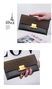 Detail of slim retro wallet with matte finish and gold metallic buckle closure
