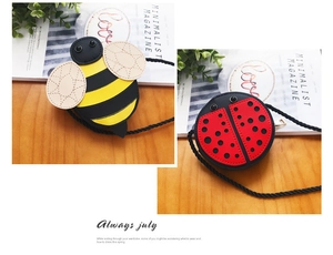 Detail of bee and ladybug crossbody bags for kids with woven straps and metal zippers