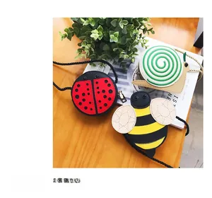 Detailed view of cute cartoon bee, ladybug, and snail mini crossbody bags for kids