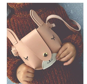 Close-up of pink bunny kids crossbody bag with golden clasp and cute leather ears