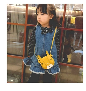 Toddler girl modeling cute bright yellow rabbit crossbody bag with 3D ears