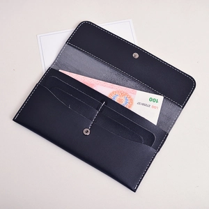 Long leather wallet for women with card slots and metal snap closure in dark blue