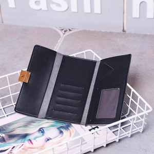 Slim tri-fold matte black long wallet for women with gold clasp and multiple card slots