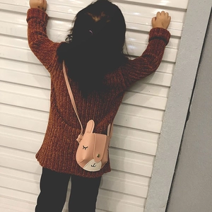 Cute pink rabbit-shaped crossbody bag for girls with long ears and embroidered expression