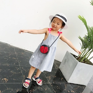 Cute gray girls' A-line tank dress with pink bows and a red ladybug crossbody bag