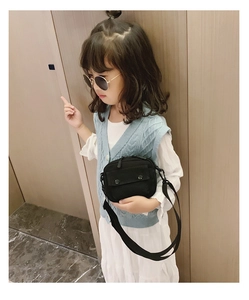 Adjustable wide strap on black canvas shoulder bag for kids in daily wear scenario