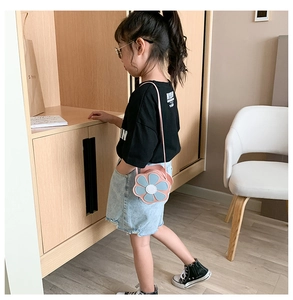 Detailed view of kids floral PU leather crossbody bag in pink and blue colors
