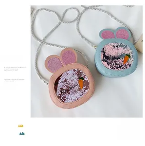 Detail of pink and blue bunny bags with sequin ears and carrot shaker window