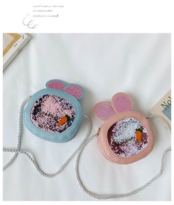 Close-up of rabbit-shaped crossbody bags with glitter ears and sequin windows