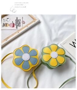 Detail of flower shaped kids crossbody bags with contrast stitching and slim straps