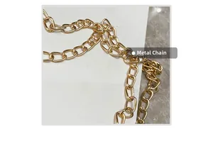 Close-up of a polished gold hardware chain strap for a women's square crossbody handbag