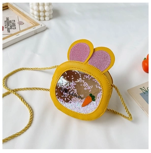Detail of yellow rabbit ear bag featuring sequin star glitter and Rabbit print design