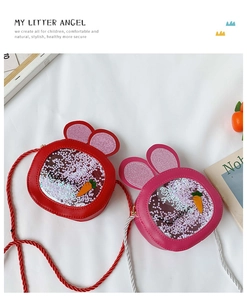 Detail view of red and pink bunny purses with glitter sequins and carrot patches