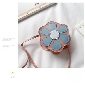 Close-up of pink and blue flower-shaped faux leather crossbody bag for girls