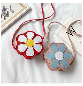 Detailed view of red and pink flower-shaped PU leather crossbody bags for girls