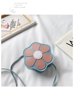 Detailed view of flower-shaped kids crossbody bag with blue and pink PU leather petals