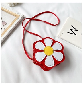Detailed view of children's red leather daisy crossbody bag with white petals