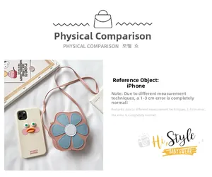 Pink flower shaped kids crossbody bag showing compact size next to a smartphone