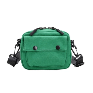 Kids minimalist solid green canvas shoulder bag with black strap and flap pocket