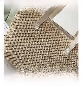 Macro shot of detailed beige woven texture on large fashion tote bag fabric