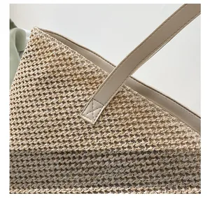 Detail shot of the reinforced cross-stitching on woven tote bag leather handles