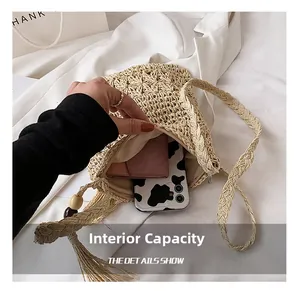 Internal capacity detail of straw woven bag with lining and wood bead tassel