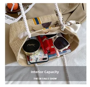 Interior view of beige straw beach tote showing spacious capacity for summer essentials