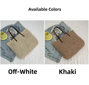 Detail of woven straw tote bags in beige and khaki colors with leather handles