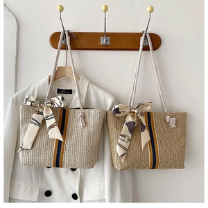 Detailed straw woven beach tote bags with cotton rope handles and silk scarf accents