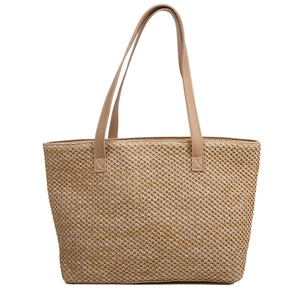 Large light brown woven straw tote bag with leather straps for summer beach fashion