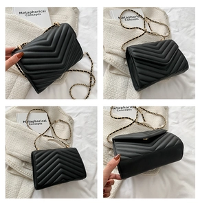 Detail view of black chevron quilted shoulder bag with gold chain strap from multiple angles