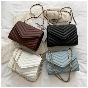 Detailed view of quilted leather chain flap bags in four stylish neutral colors