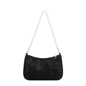 Black lace baguette bag with oversized pearl handle and gold zipper closure