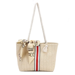 Straw beach tote bag with cotton rope handles and decorative ribbon and scarf