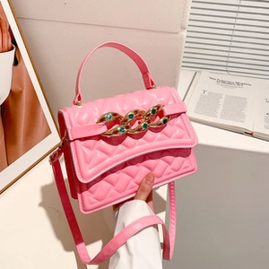 Pink quilted PU crossbody bag featuring a golden chain strap with colorful rhinestones