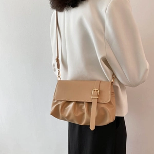 Fashionable khaki pleated shoulder bag for women with decorative strap and gold buckle detail