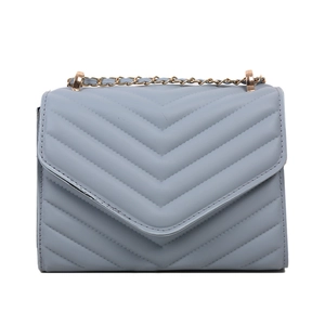 Blue quilted flap shoulder bag with gold chain strap and elegant chevron stitching