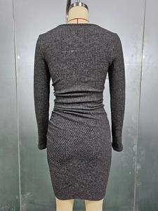 Detail view of the ribbed knit fabric and slim fit design on the back of the grey bodycon dress