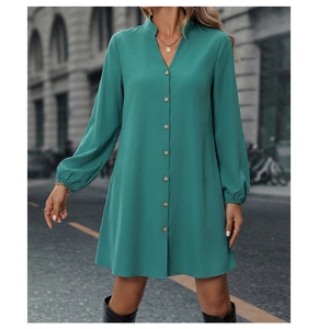 Lake green long sleeve dress with button-down front and stand collar in street setting