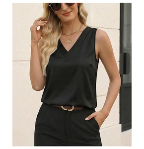 Detail shot of black satin V-neck sleeveless top with silky texture and slim fit design