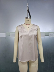 Detail view of champagne satin sleeveless V-neck top on mannequin in size S
