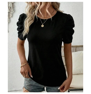 Detail of puffed sleeves with delicate lace embroidery on this black women's t-shirt