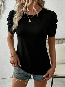 Women's black short sleeve T-shirt with puff sleeves and hollow out embroidery details