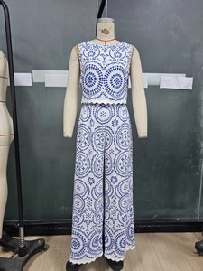 Detail of blue and white mandala print sleeveless crop top and wide-leg trousers set