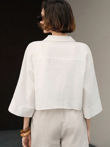Minimalist white cotton cropped long-sleeve shirt with wide sleeves for women
