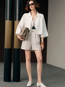 Three-piece women's set with white cotton shirt, crop top, and grey high-waist shorts