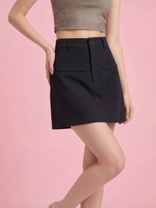 Women's black high-waisted A-line mini skirt with a single button and decorative pockets